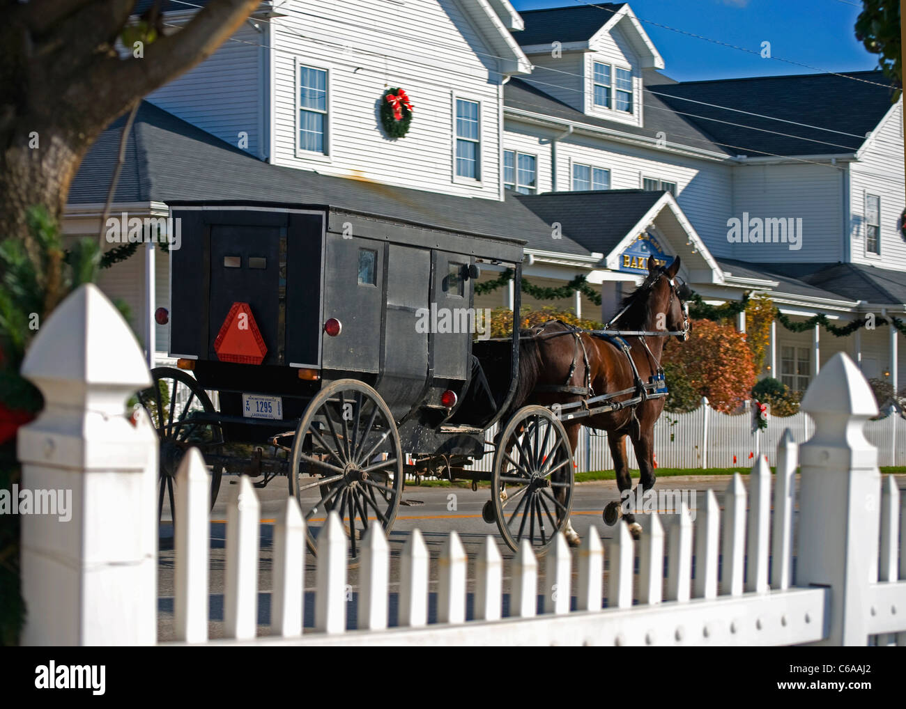 Amish buggy  passing by the famous Blue Gate Restaurant and Bakery, popular for its Amish food, in Shipshewana, Indiana. Stock Photo