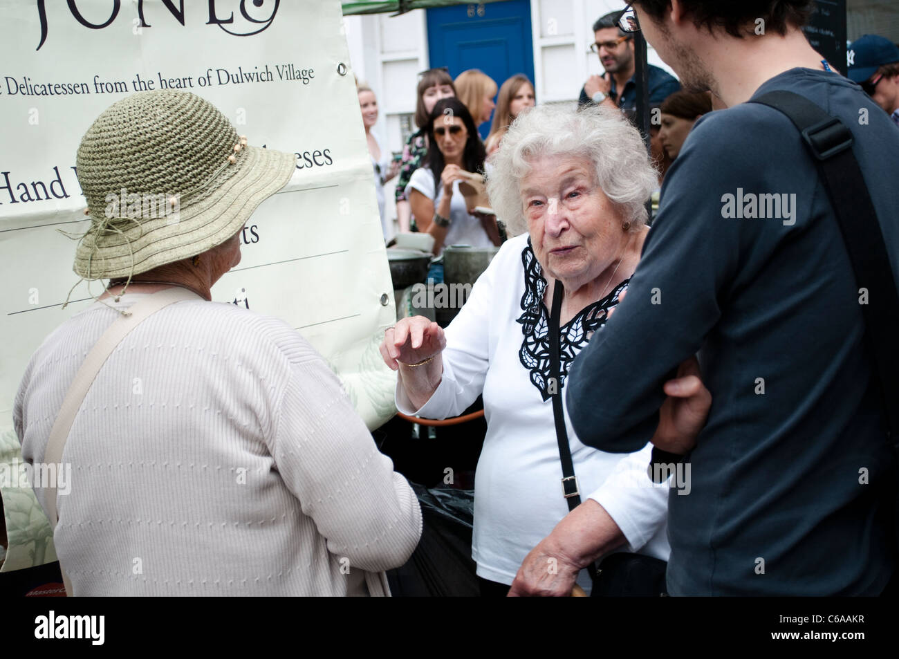 Elderly women talking, Broadway Market, Hackney, London, UK Stock Photo