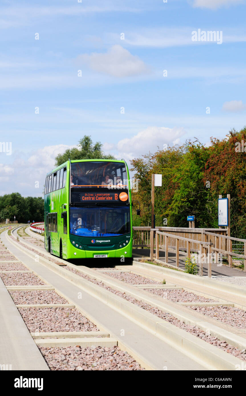 A Double Decker Bus on The Cambridge Guided Busway at Fen Drayton Lakes RSPB Nature Reserve, Cambridgeshire, England, UK Stock Photo