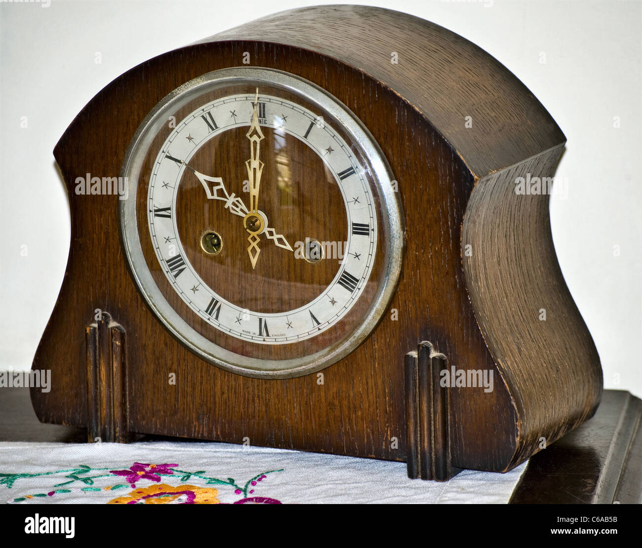 An early wooden mantelpiece clock (timepiece Stock Photo Alamy