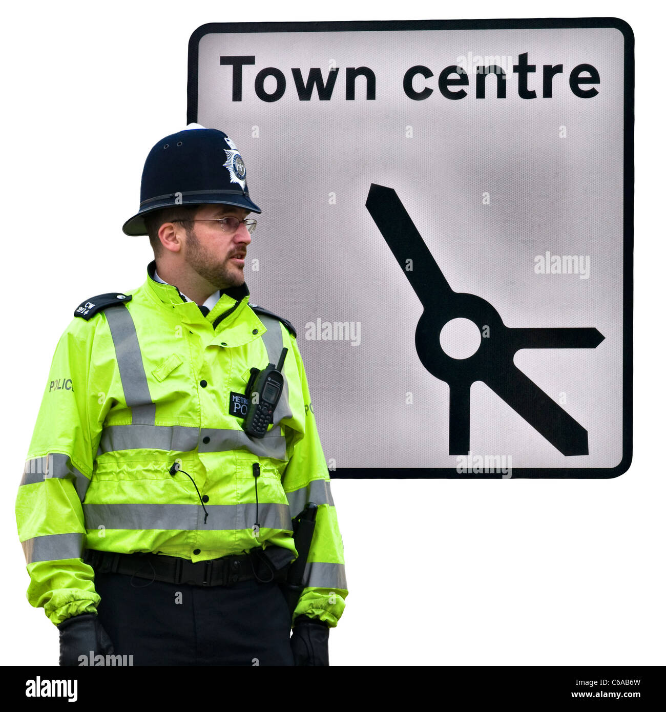 Road sign pointing to the town centre (includes roundabout detail), Standing policeman / police officer cut out England, UK Stock Photo