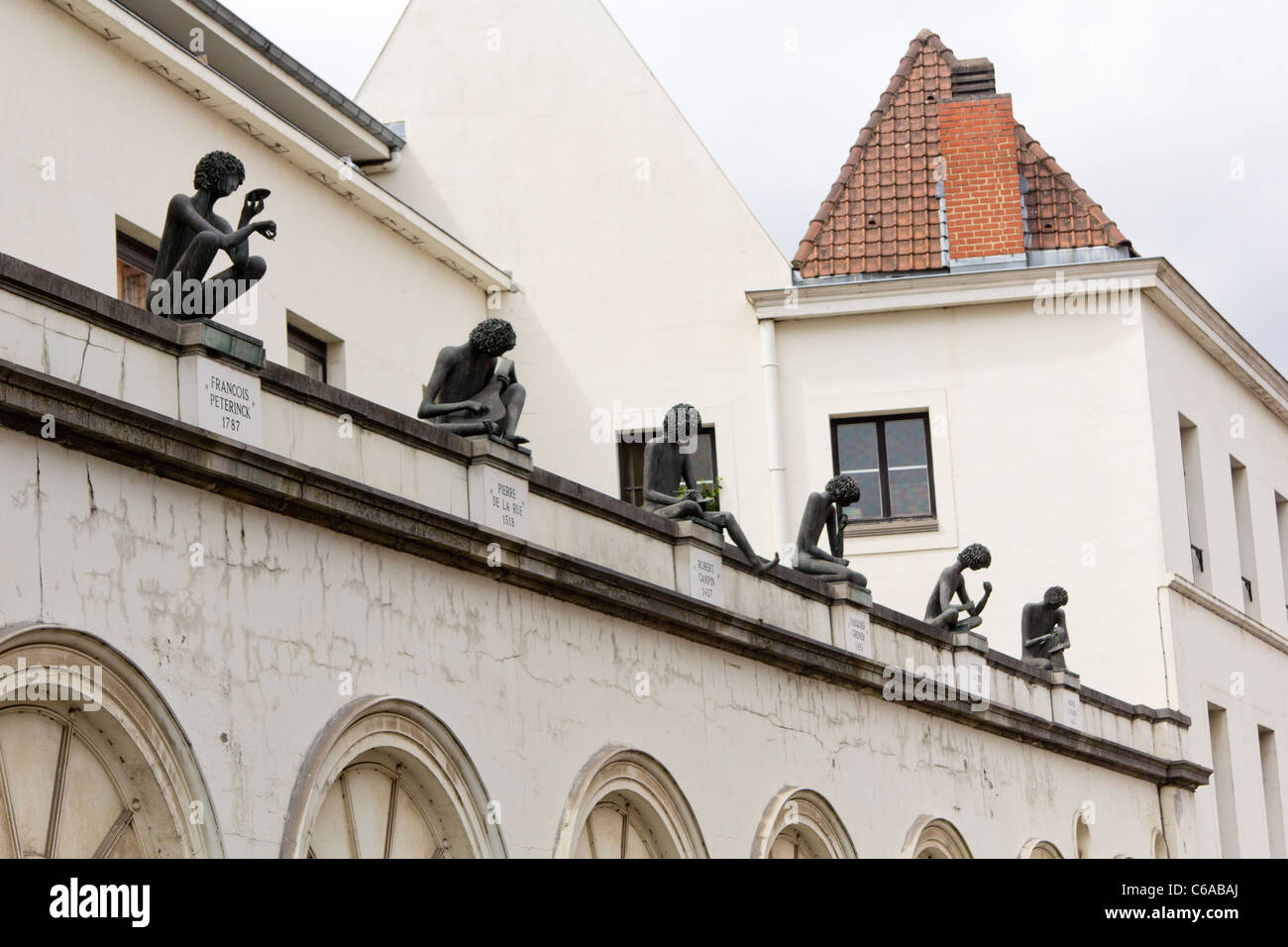 Sculptures of historical figures from the town on the structure of Conservatoire de Musique, Tournai, Belgium Stock Photo