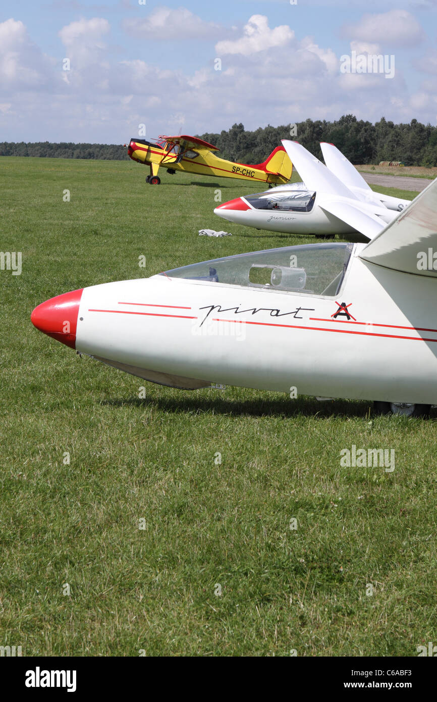 Gliders SZD 30 Pirat glider with tug towing aircraft behind at a gliding airfield in Poland Stock Photo