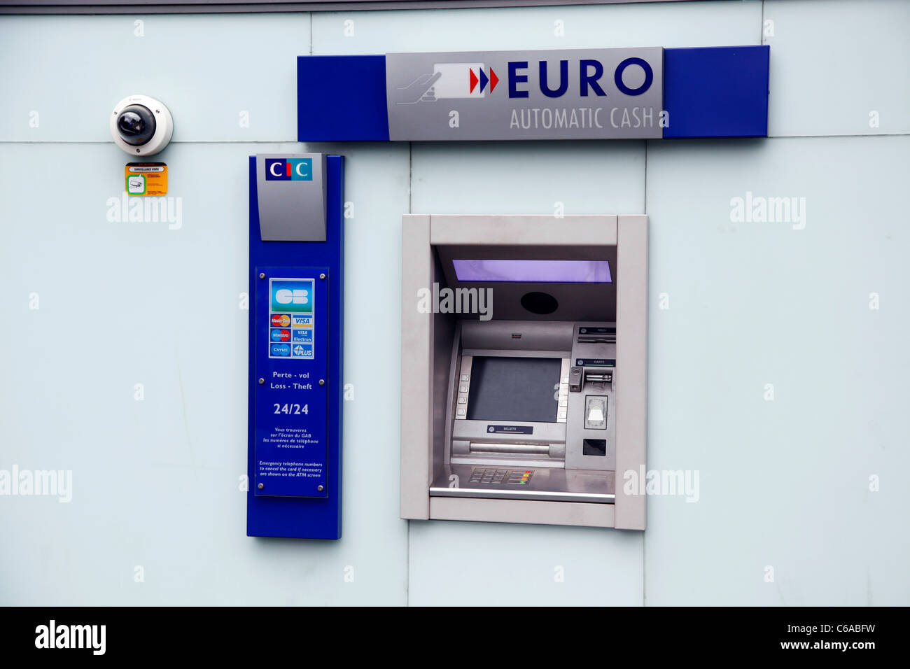 Euro ATM cash machine dispensing money at a bank in Paris, France Stock Photo