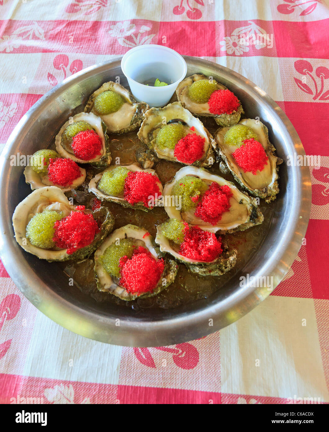 "Oysters Japanoise," raw oysters served with flying fish roe, ponzu sauce, chives and wasabi at