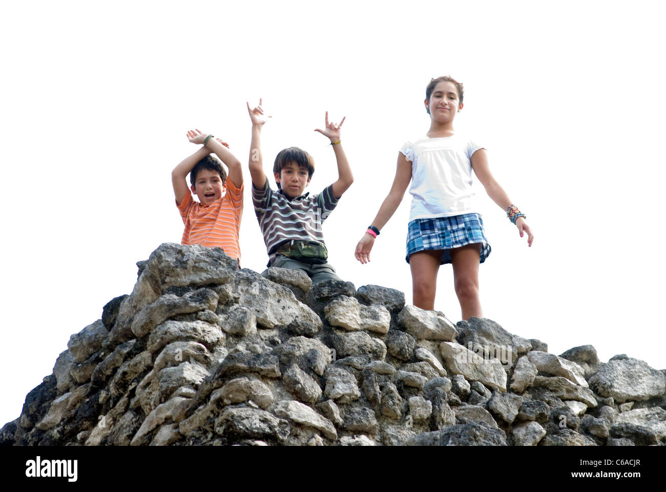 The President's children waving to him from atop pyramid at Calakmul Stock Photo