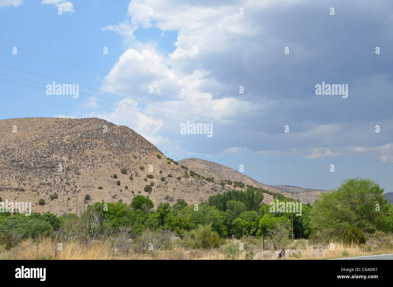 A landscape of mountain,trees and cloudy sky Stock Photo - Alamy