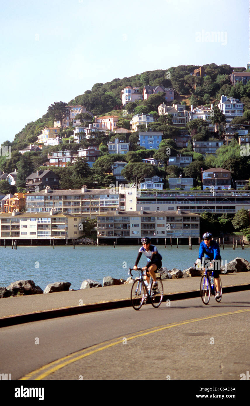 two bicyclists ride into the Hurrican Gulch section of Sausalito Stock Photo