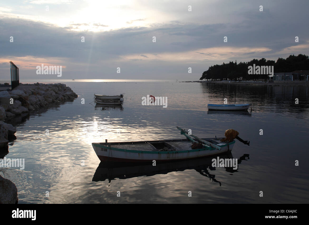 Boats in a bay at dusk in Umag,Croatia Stock Photo