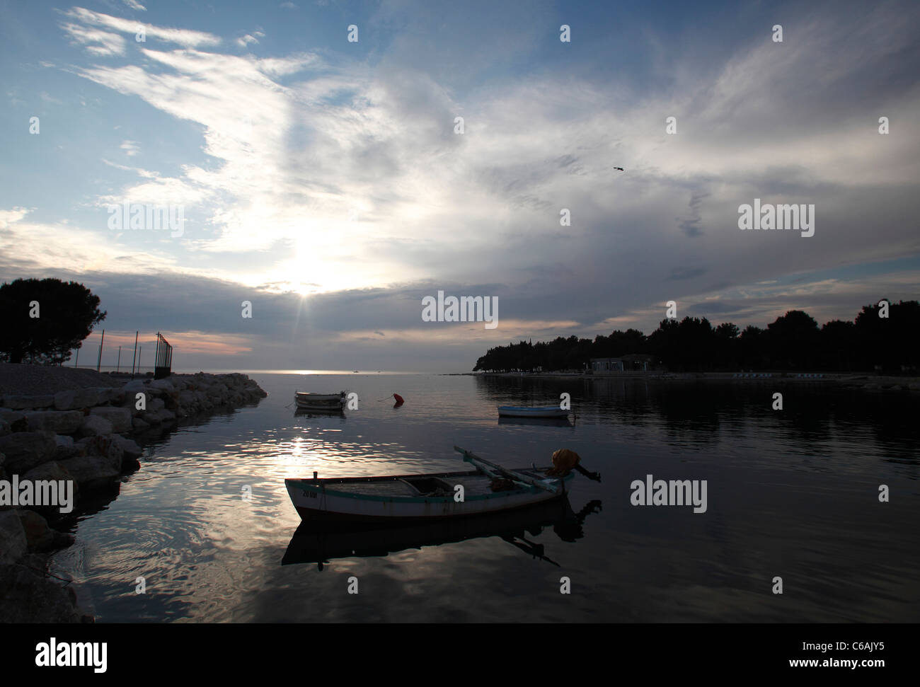 Boats in a bay at dusk in Umag,Croatia Stock Photo