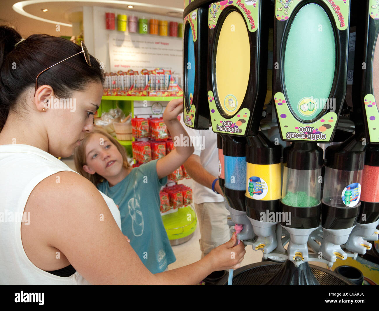 Two girls buying sweets in the Candylicious store, Sentosa Island Singapore  Stock Photo - Alamy