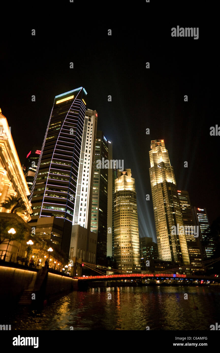 Skyscrapers in the Financial District at night, seen from the river, Singapore Stock Photo