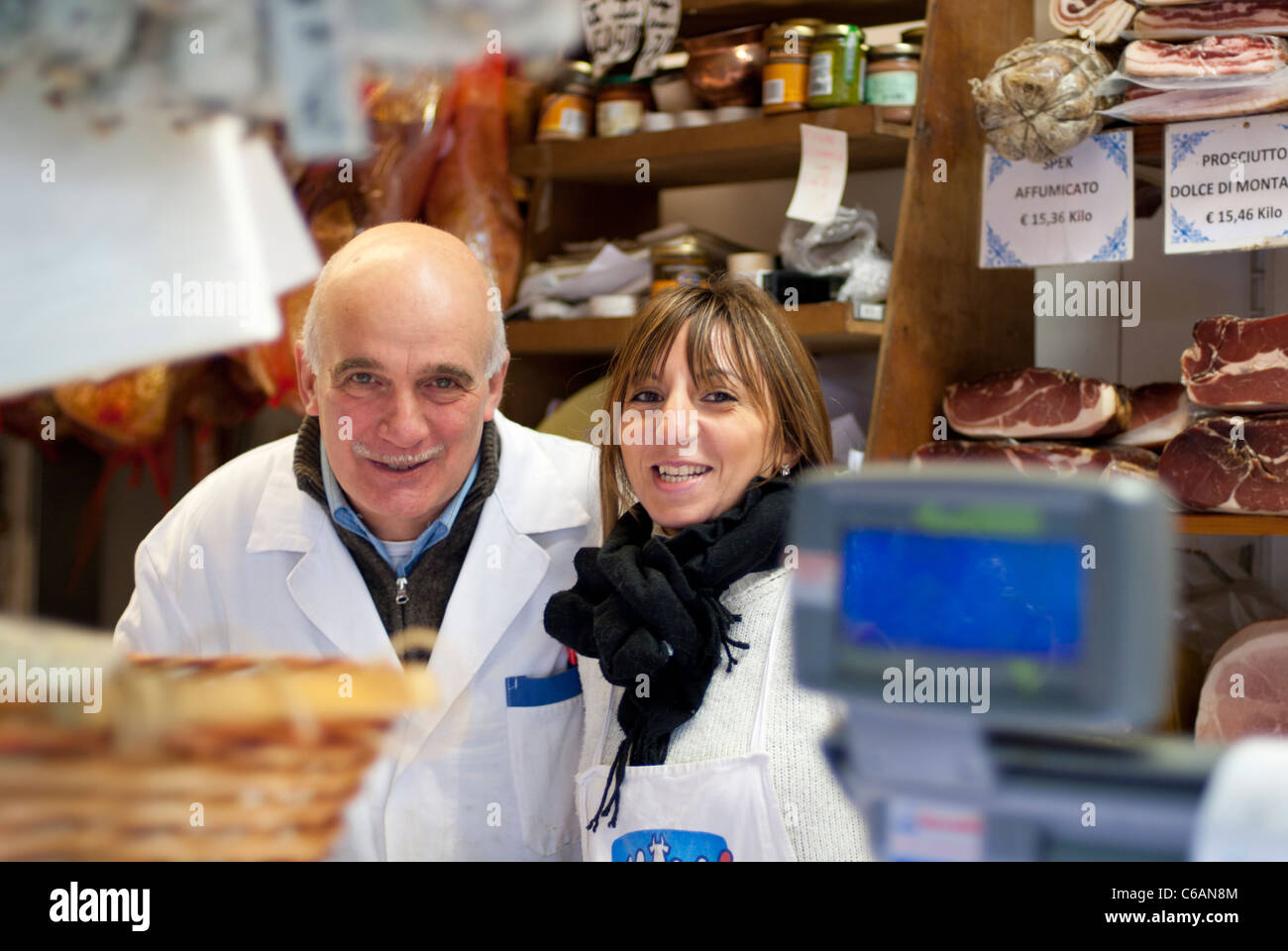 Delicatessen sellers in the Central Market, Florence, Italy Stock Photo
