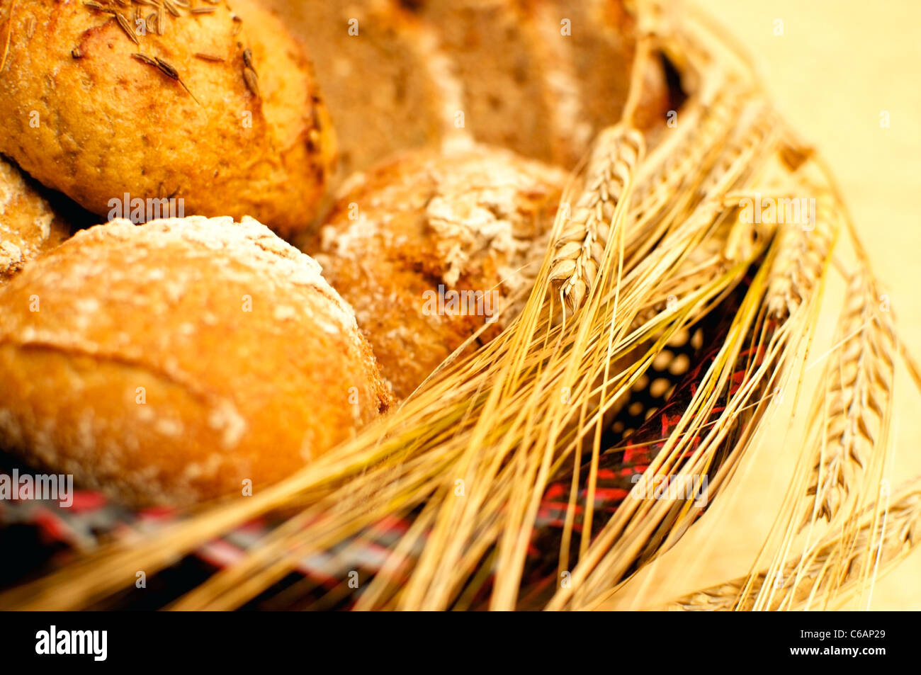 Wholegrain Bread and Buns with ears of wheat and barley Stock Photo
