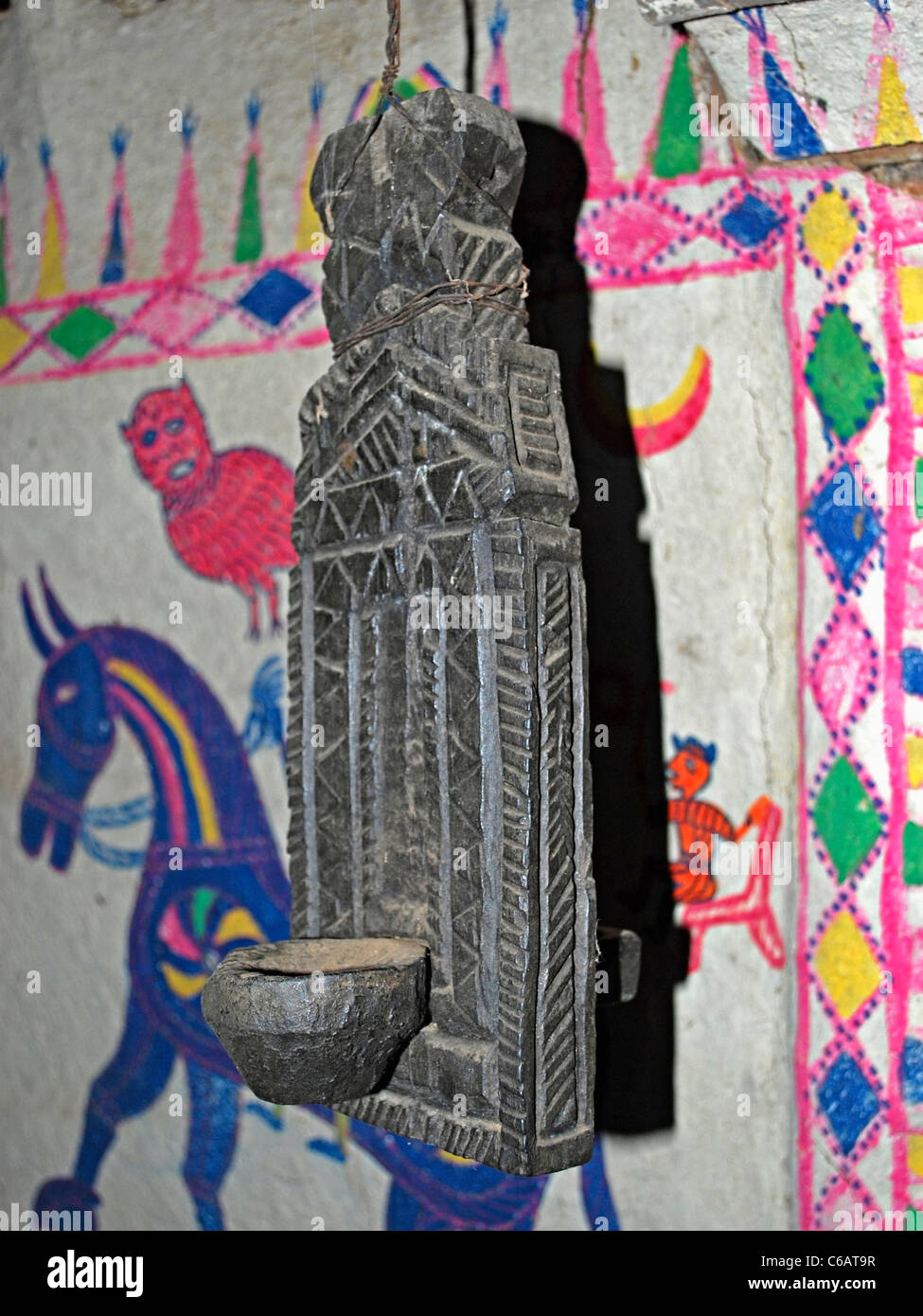 Antique wooden oil lamp displayed in a museum, Madhya pradesh, India