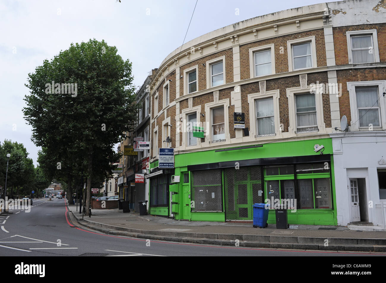 Typical terraced houses and empty shops and properties for sale and to rent in the London