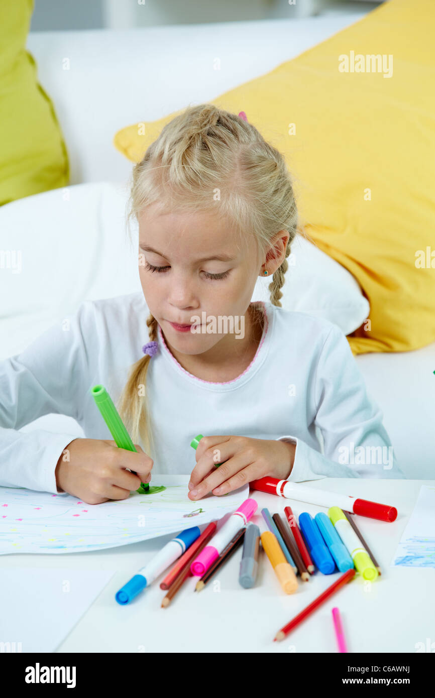 Portrait of lovely girl drawing with colorful pencils Stock Photo - Alamy