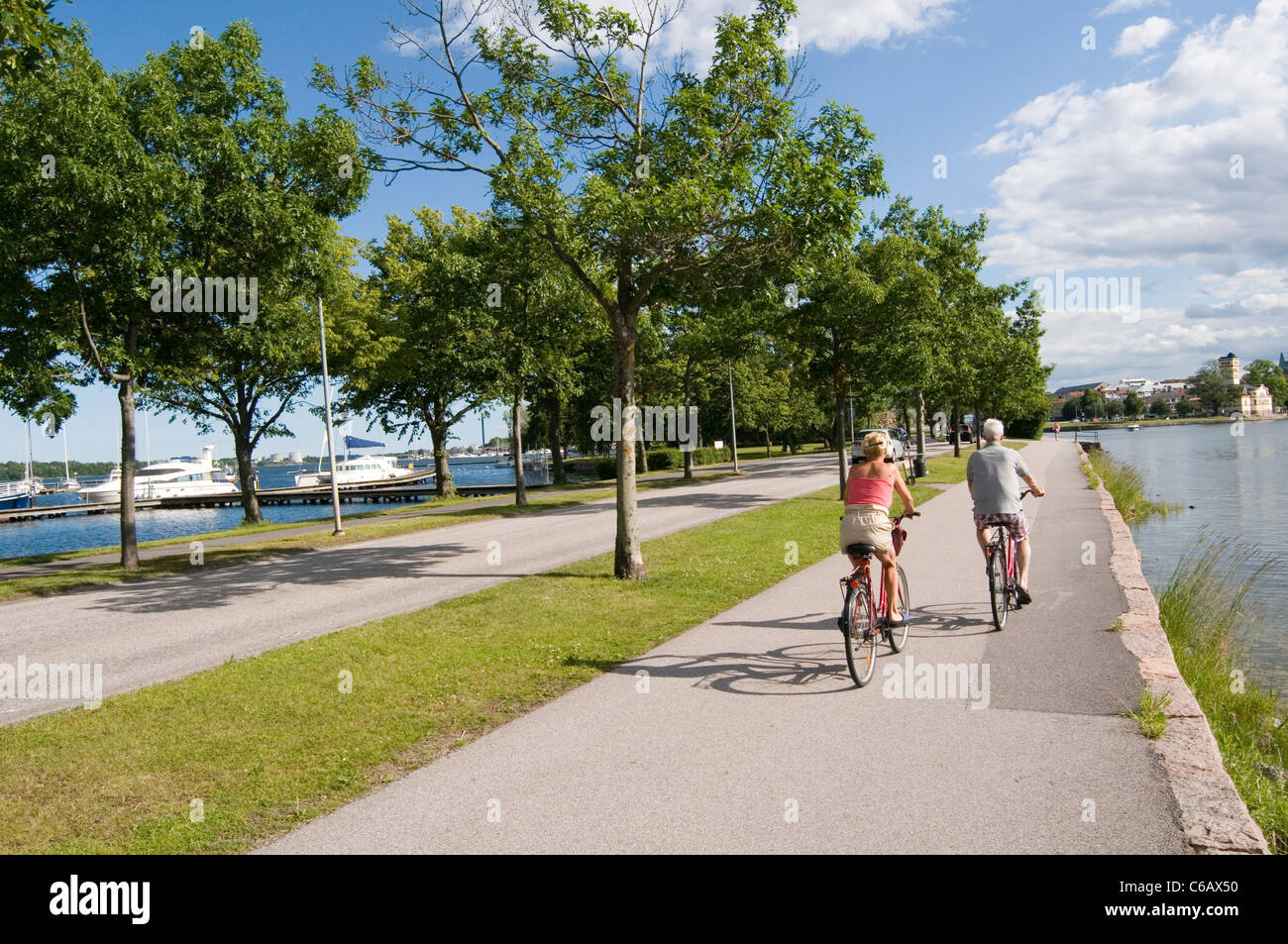 Västervik sweden swedish town cycle path paths cyclepath cyclepaths bike cycle cycling ride riders path paths summer summertime Stock Photo
