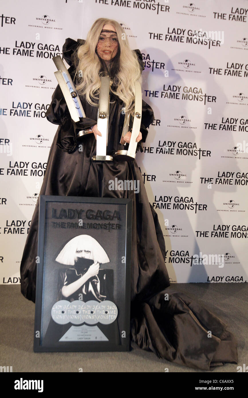 Lady Gaga receives 4 platinum awards for her album 'The Fame Monster' during a photocall at O2 World arena. She also picked up Stock Photo