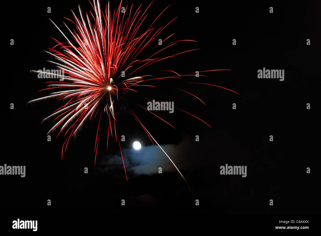 Firework with moon on black background. Stock Photo
