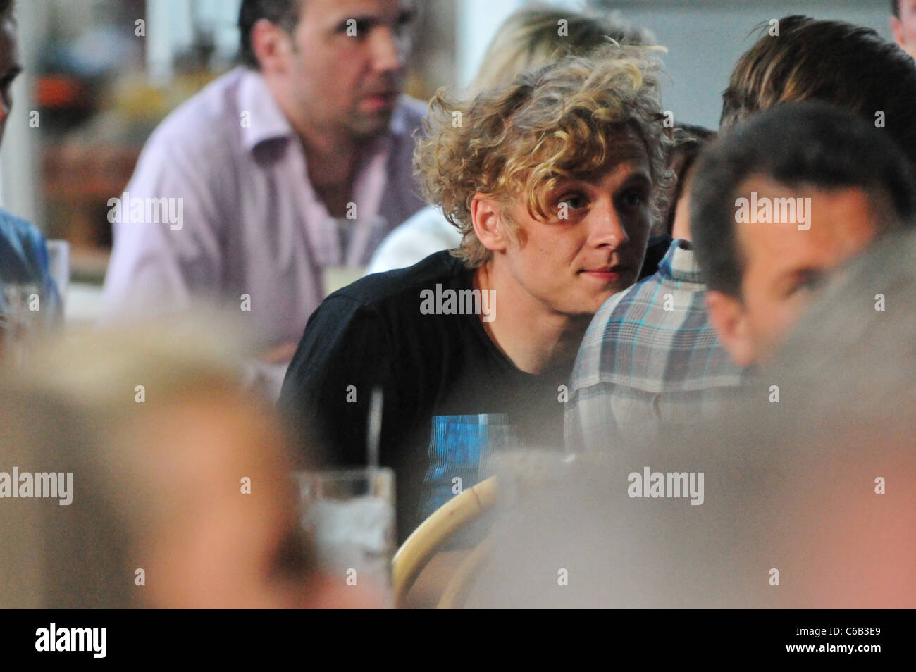 German actor Matthias Schweighoefer watching the World Cup 2010 semi finale between Germany and Spain at Cafe am neuen See Stock Photo