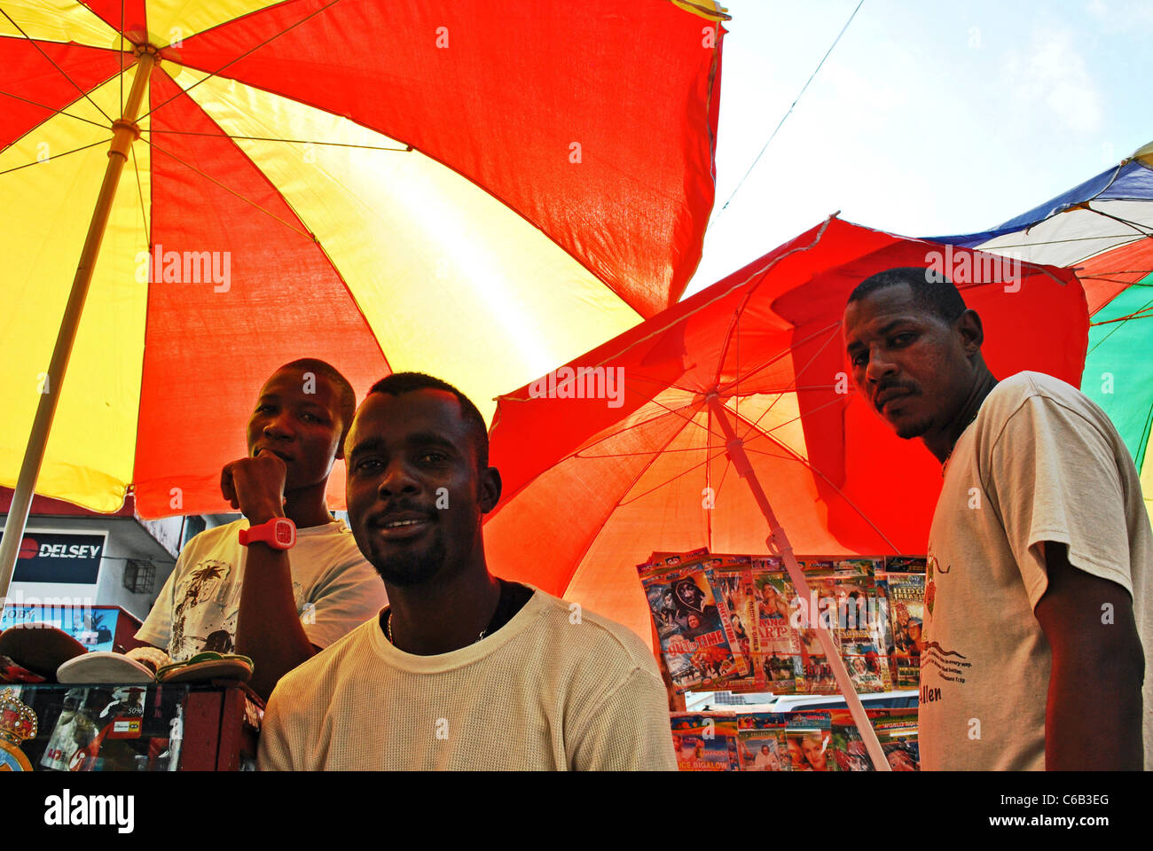 Street vendors under sun umbrellas in Monrovia, Liberia Stock Photo