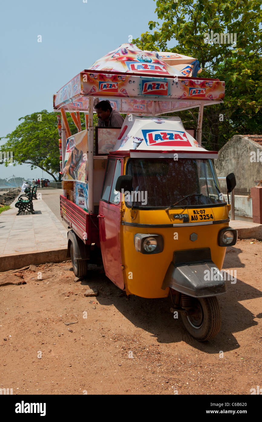 Auto Rickshaw Ice Cream Van by the Sea Wall near the Chinese Fishing Nets, Fort Cochin, India Stock Photo