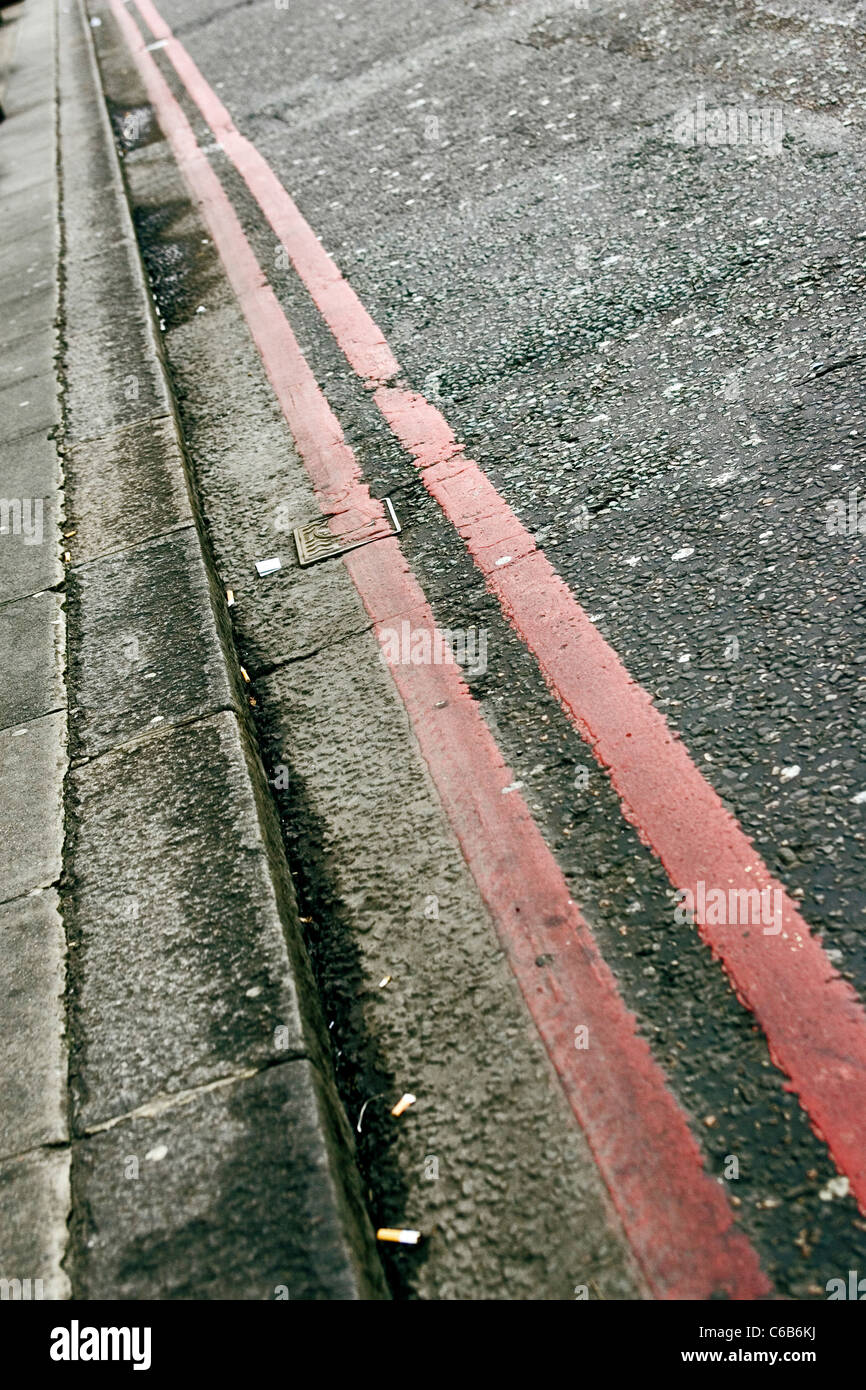 Red Route no stopping lines marking the side of a road in Victoria
