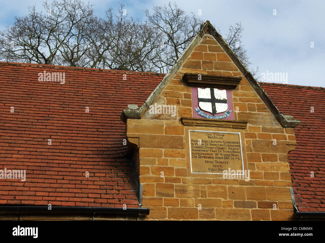 Inscription above a row of almshouses, Dallington village, UK Stock Photo