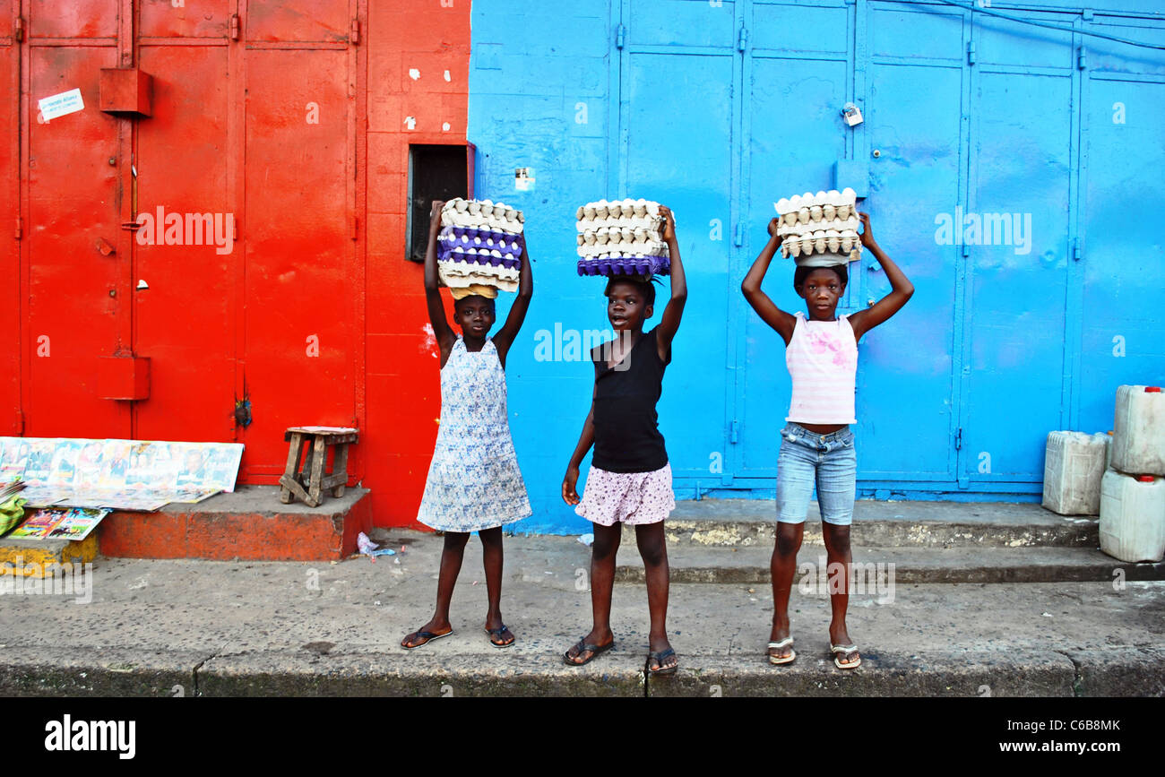 Girls sell eggs in the center of Monrovia, Liberia, West Africa Stock Photo