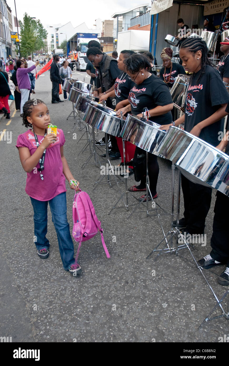 Band member from Metronomes Steel Orchestra playing steel drum at the Notting Hill Panorama