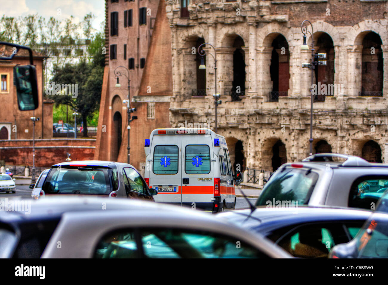 Rome Italy Europe, Italian ambulance near amphitheater like Colosseum working traveling Stock Photo