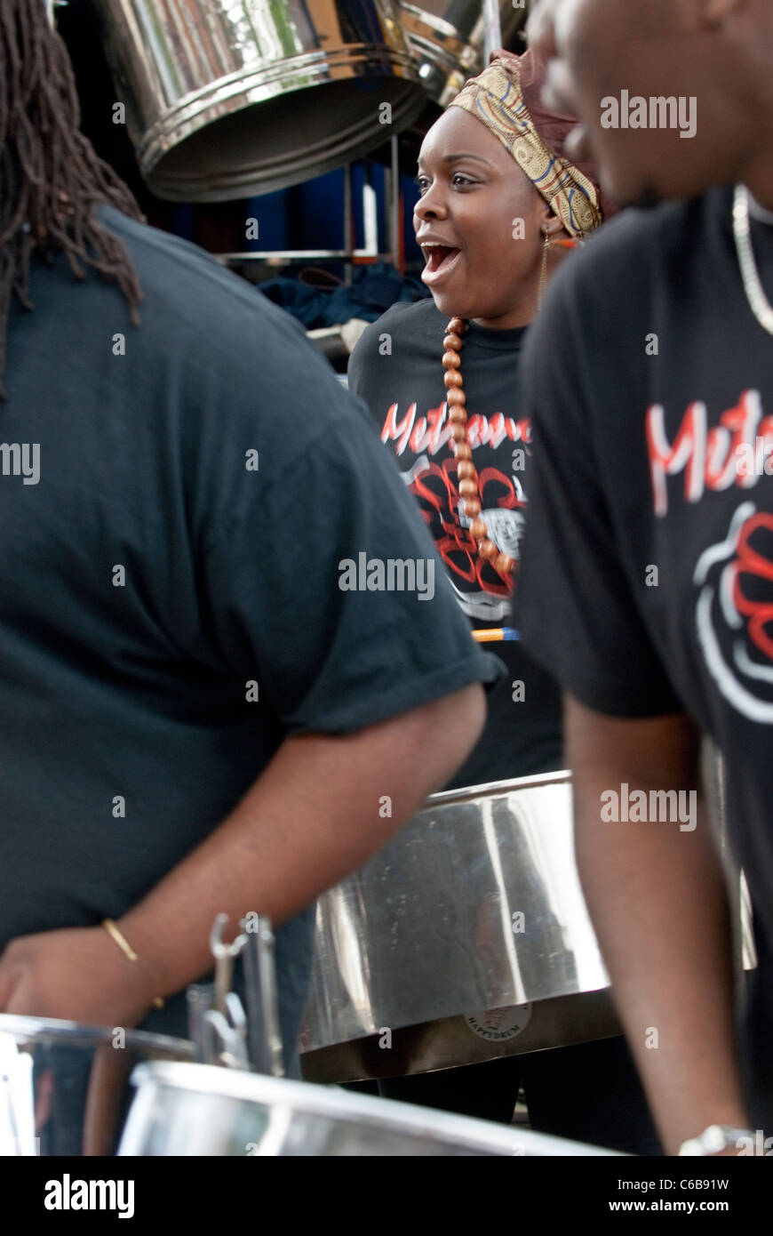 Band member from Metronomes Steel Orchestra playing steel drum at the Notting Hill Panorama