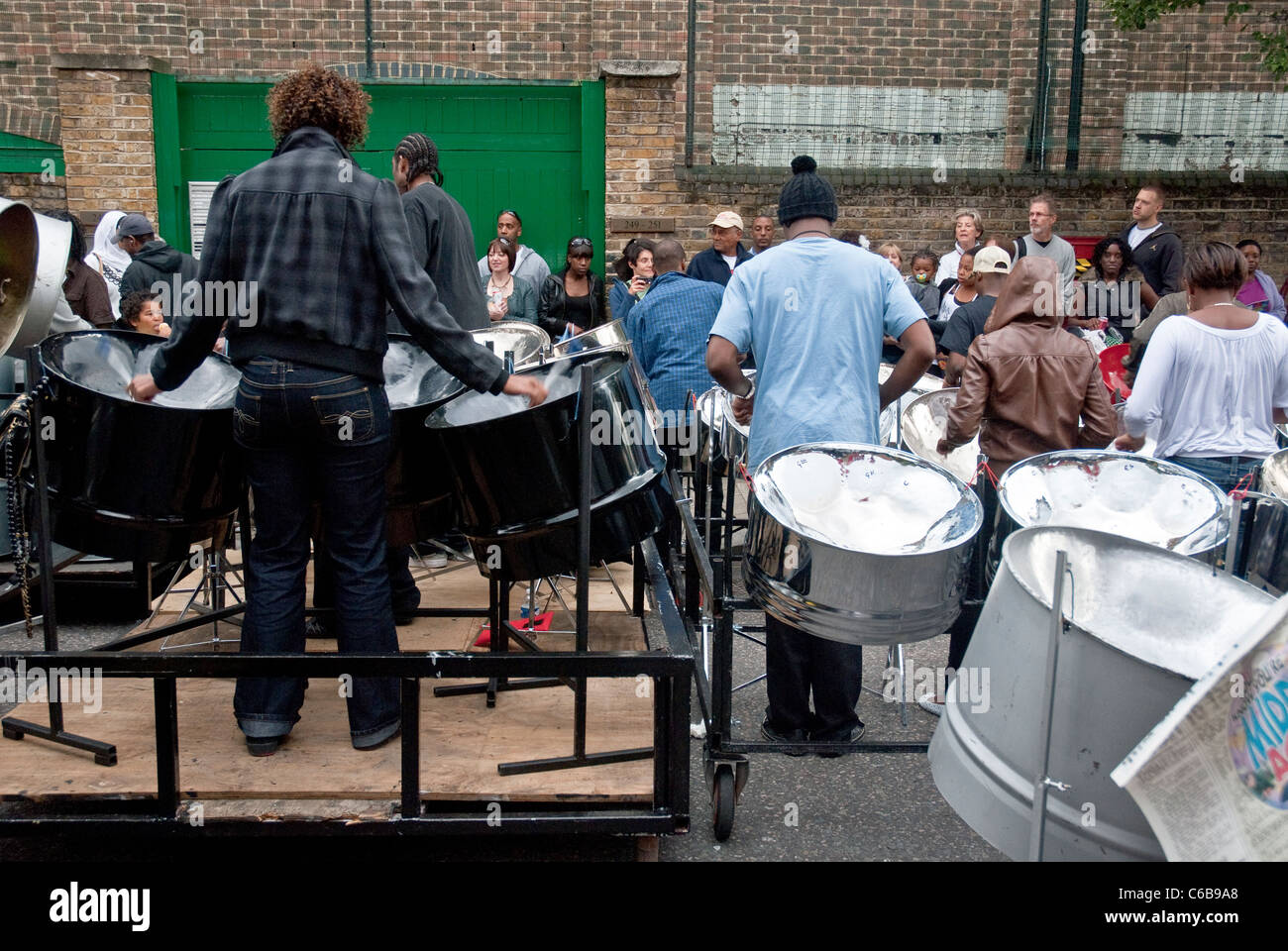 Band member(s) from Croydon Steel Orchestra playing steel drum at the Notting Hill Panorama Championships Stock Photo