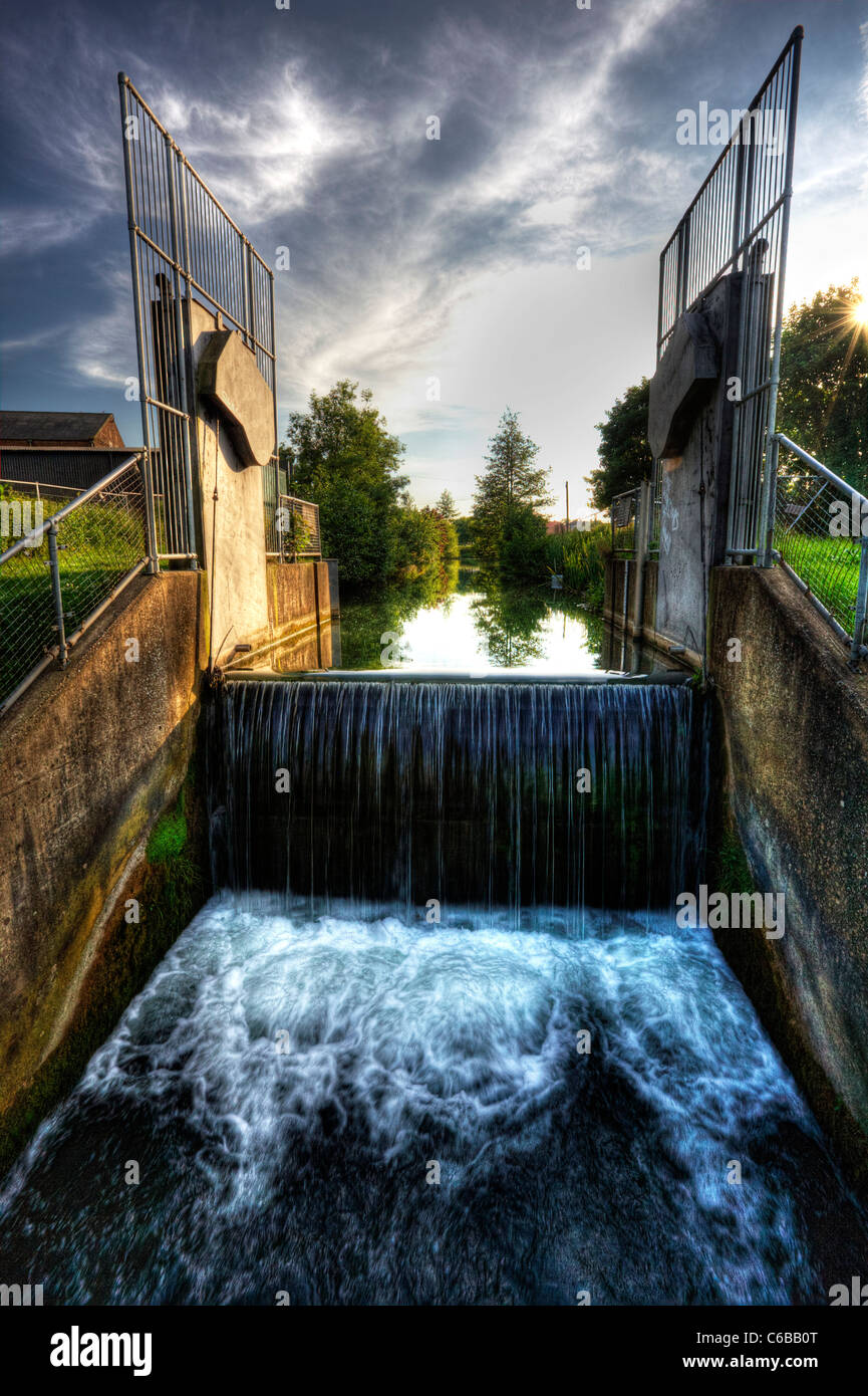 HDR tonemapped to add drama, dramatic effect. Louth canal Lincolnshire river lud lock waterfall Stock Photo