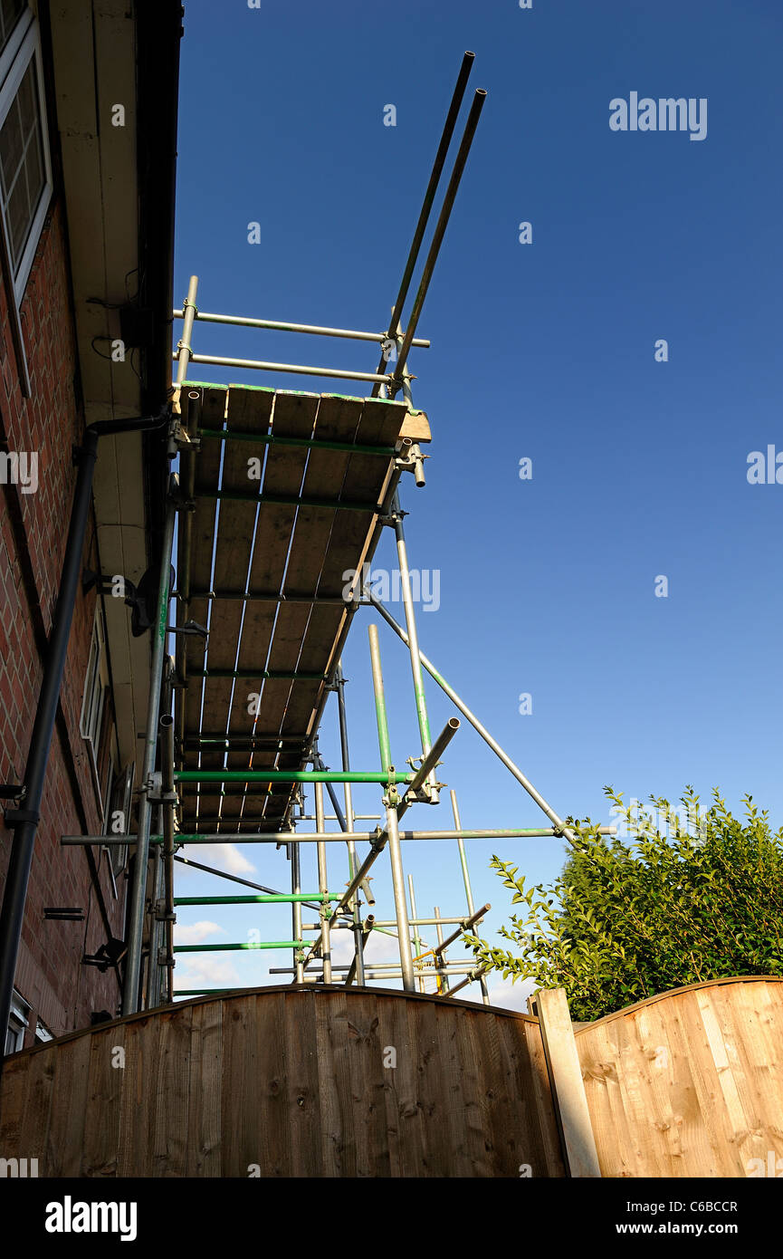 scaffolding erected on the side of a house england uk Stock Photo Alamy