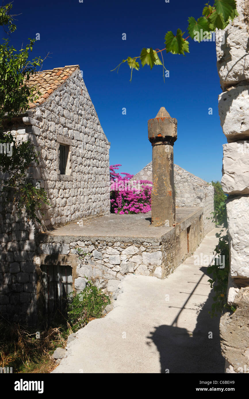 Street of old town Lastovo and famous and recognizable chimney called ‘fumar’ (pl. fumari, lat. Fum – smoke, vapor). Stock Photo
