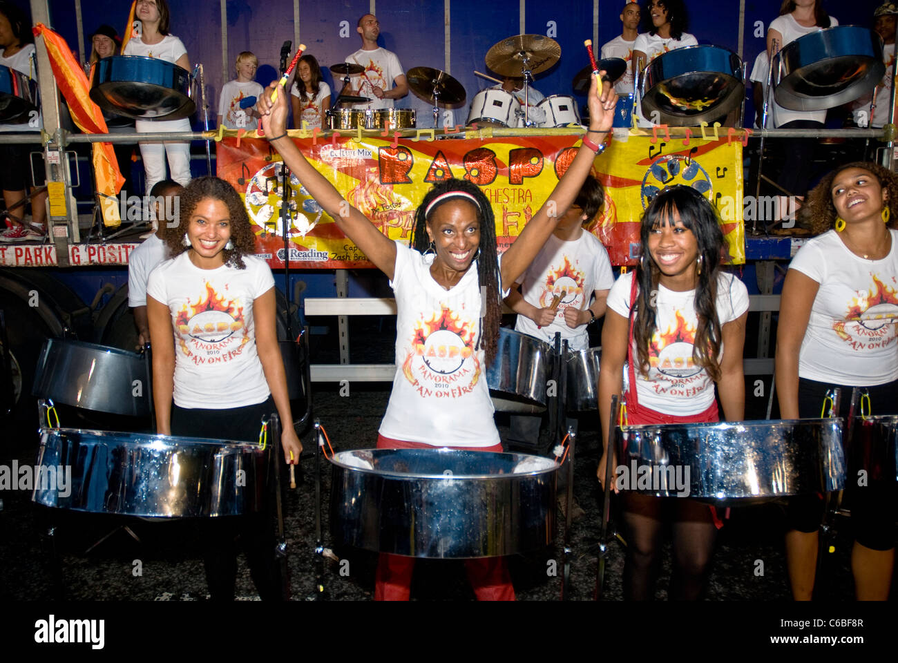 Band member from Rapso Steel Orchestra, Pan on Fire, playing steel drum