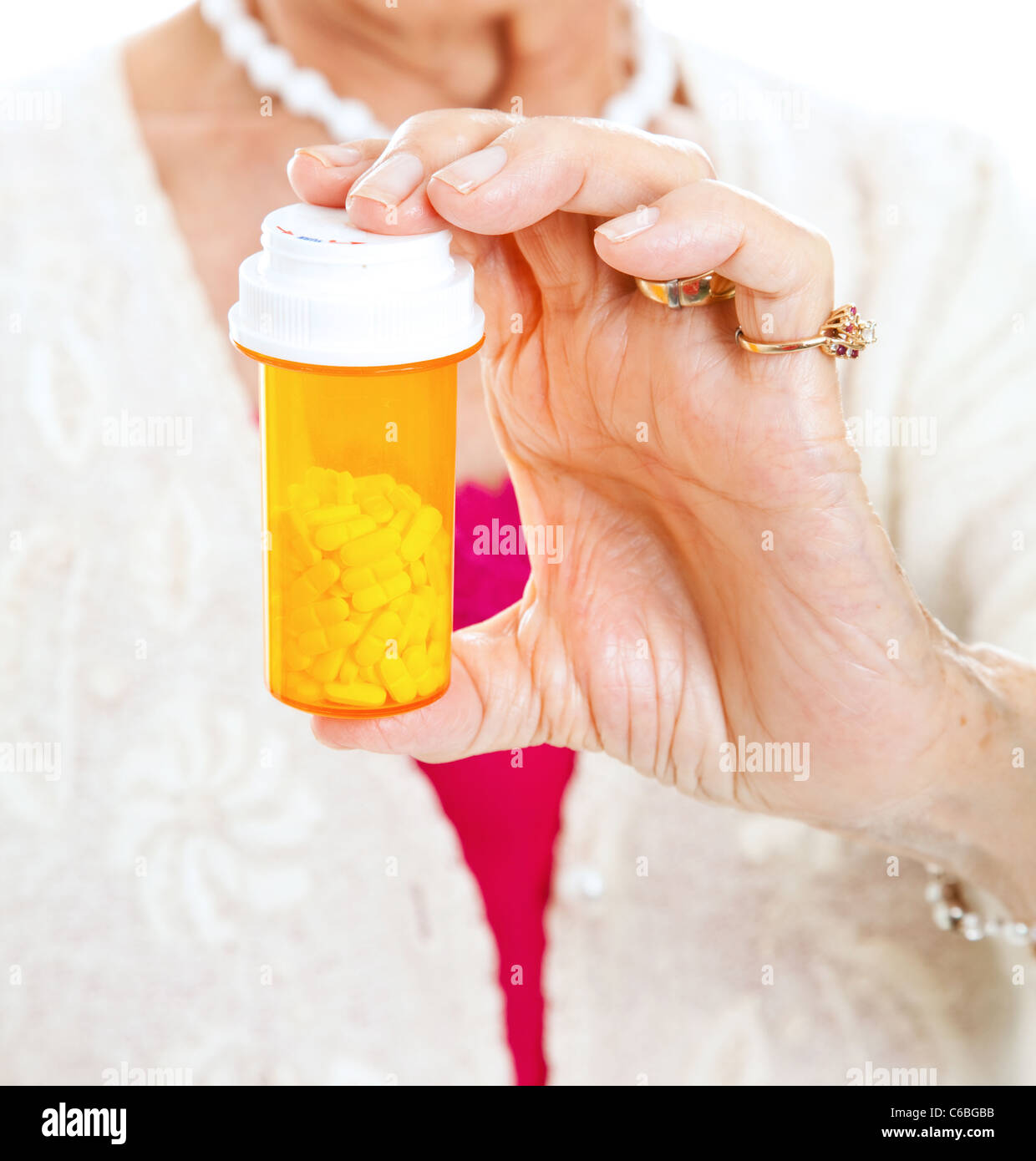 https://c8.alamy.com/comp/C6BGBB/closeup-of-a-bottle-of-prescription-pills-in-the-hand-of-a-senior-C6BGBB.jpg