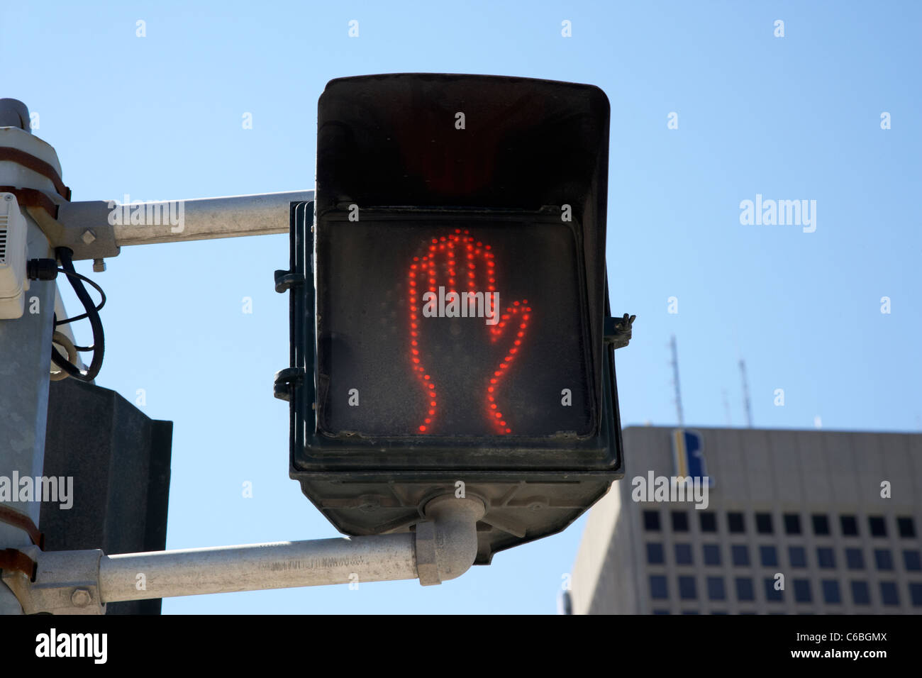 low energy led halt dont cross red hand pedestrian crossing sign in downtown winnipeg manitoba canada Stock Photo