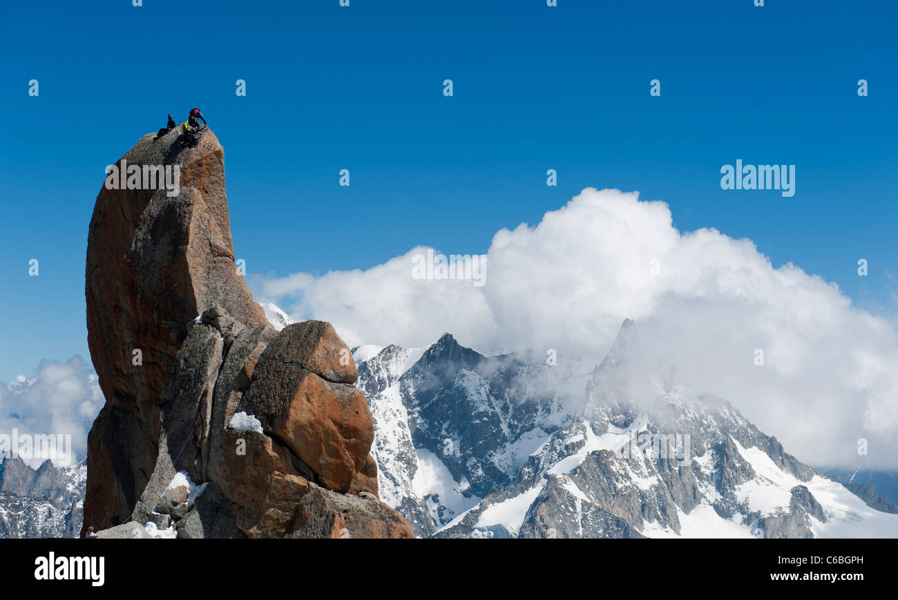Climbers on top of Voie Rebuffat in Aiguille du Midi, Mont Blanc range, Chamonix, France Stock Photo