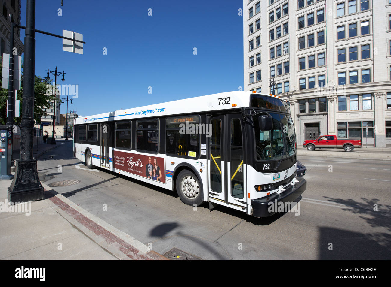 winnipeg transit bus travelling along main street downtown winnipeg