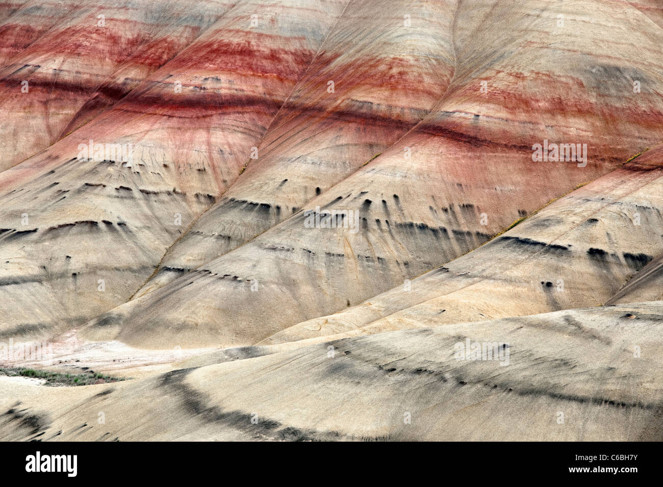 Bands of colorful ash deposits highlight Oregon’s Painted Hills Unit and the John Day Fossil Beds National Monument. Stock Photo