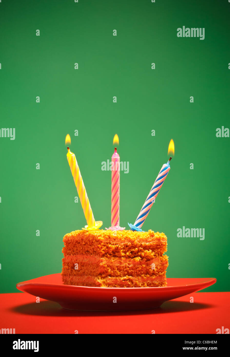 birthday cake with candle on pink background Stock Photo - Alamy
