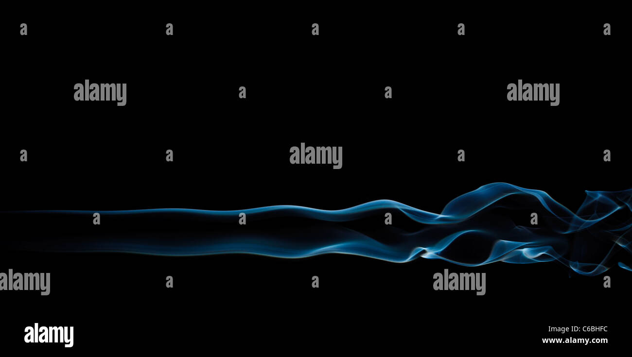 blue abstract smoke pattern on a black background Stock Photo - Alamy