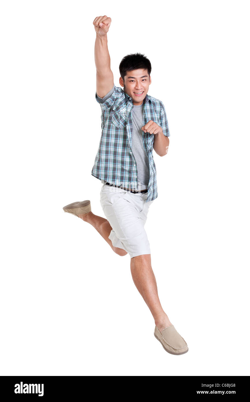 Studio shot of a happy young man Stock Photo - Alamy