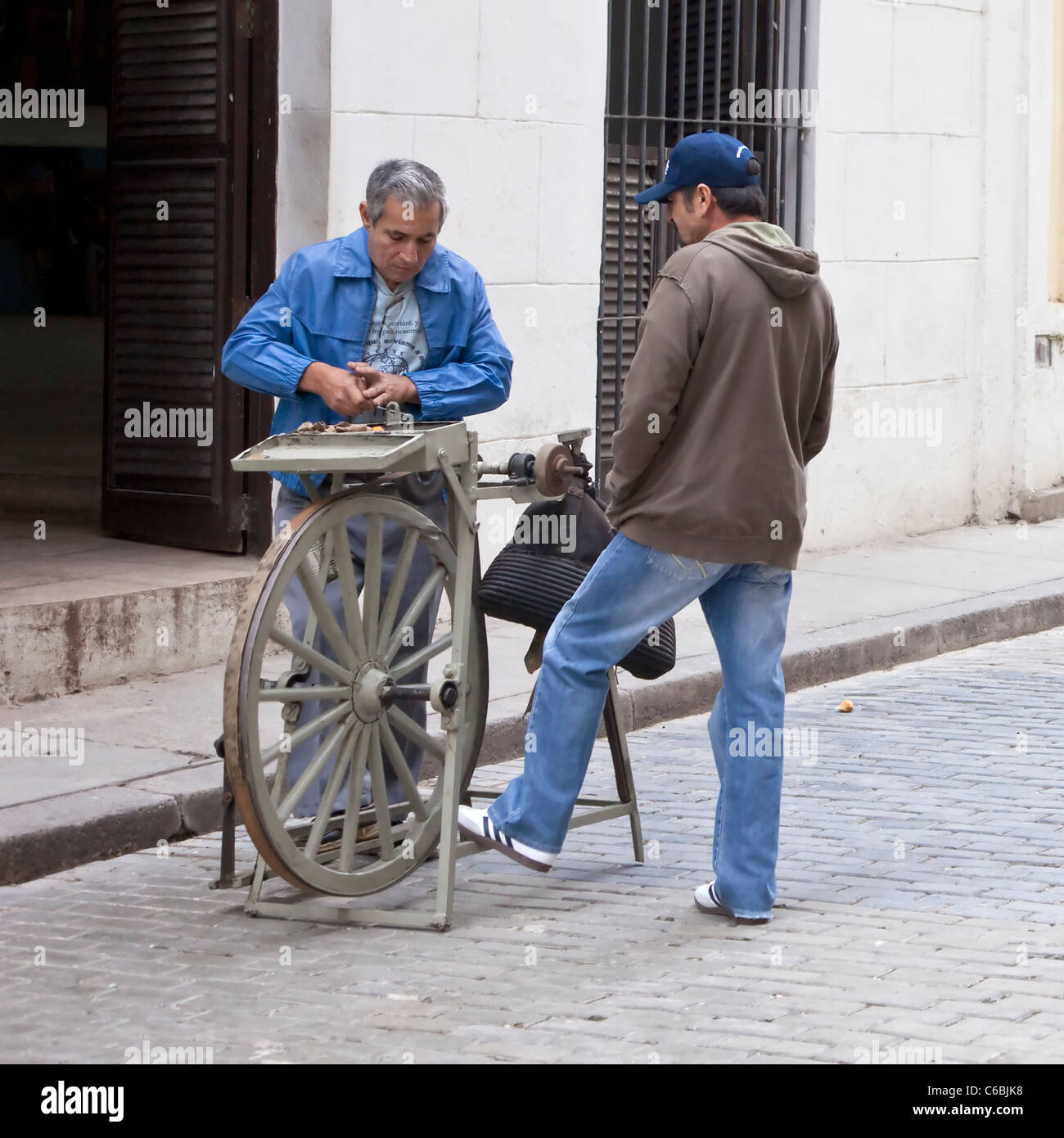 Cuba, Havana. Street Scene, Old Havana, Knife Sharpener. Stock Photo