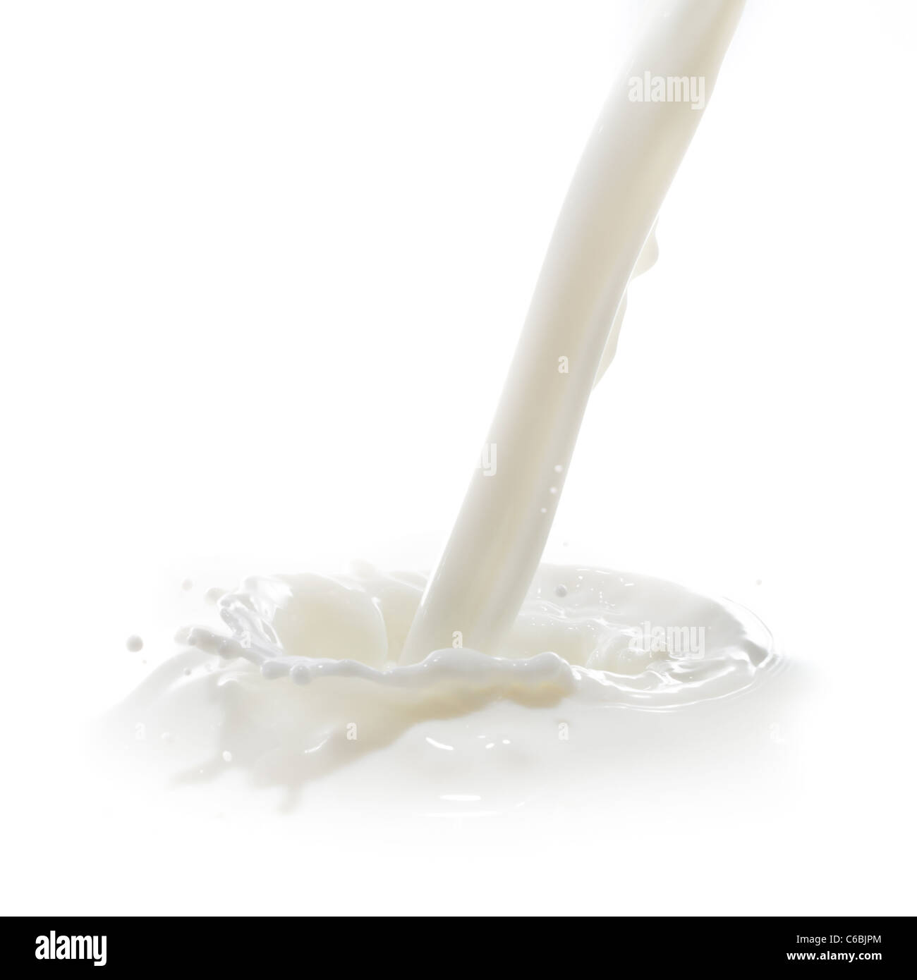 pouring milk splash isolated on white background Stock Photo - Alamy