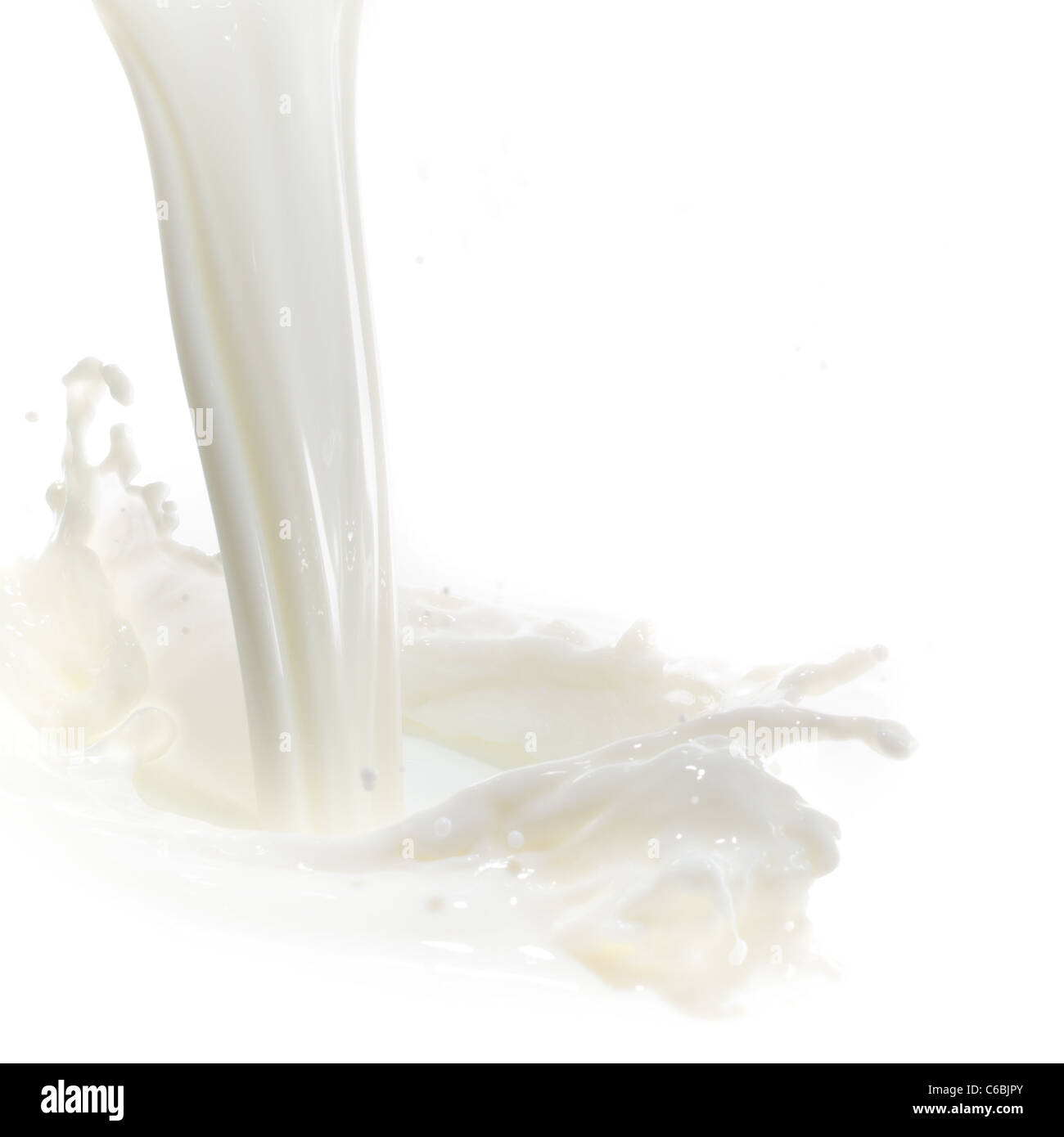 pouring milk splash isolated on white background Stock Photo - Alamy