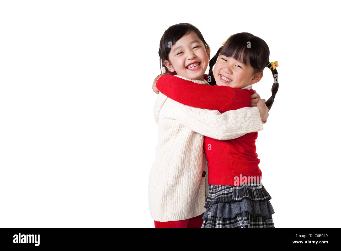 Two Chinese girls hugging Stock Photo Alamy